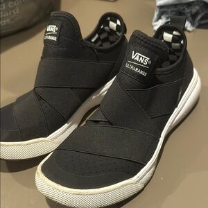 Vans Black and White Slip-On Sneakers